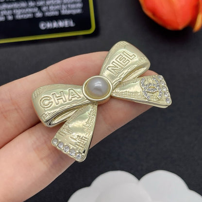 CC Bow Tie Gold Brooch