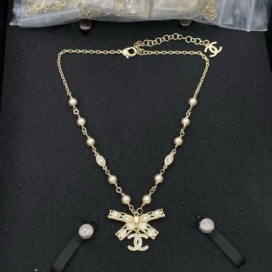 CC Bow Tie Diamond Gold Necklace