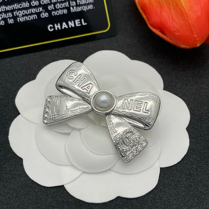 CC Bow Tie Gold Brooch