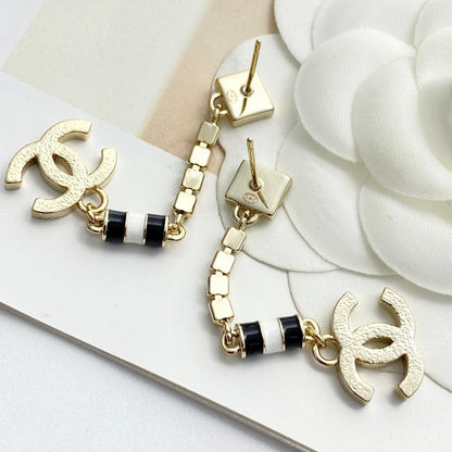 CC 24C Black Gold Tassel Earrings
